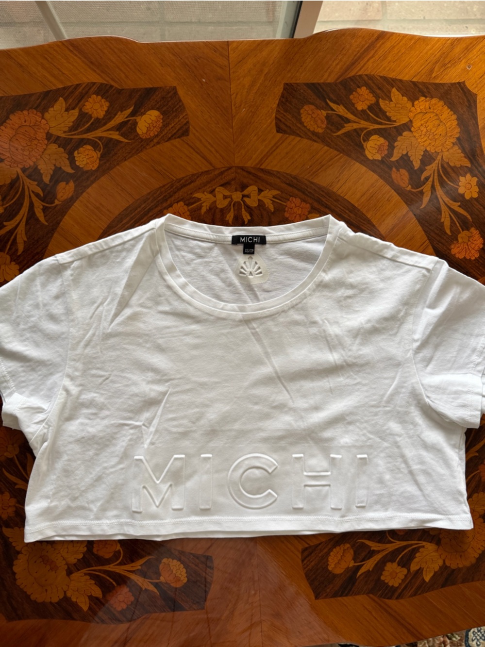 MICHI White Crewneck Tee with Embossed Sunburst Detail